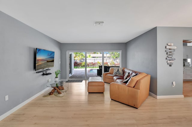 living room with light hardwood / wood-style flooring