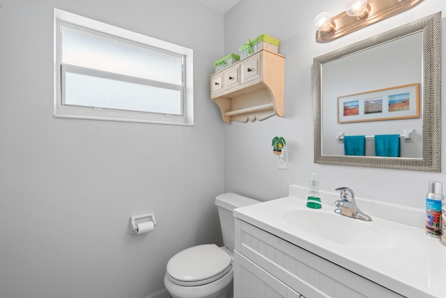 bathroom with toilet and vanity