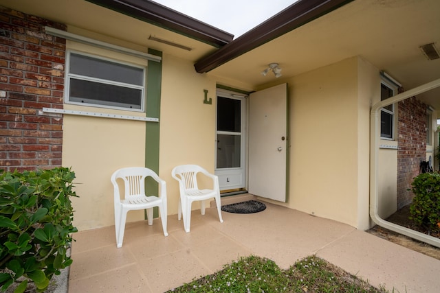 doorway to property featuring a patio area