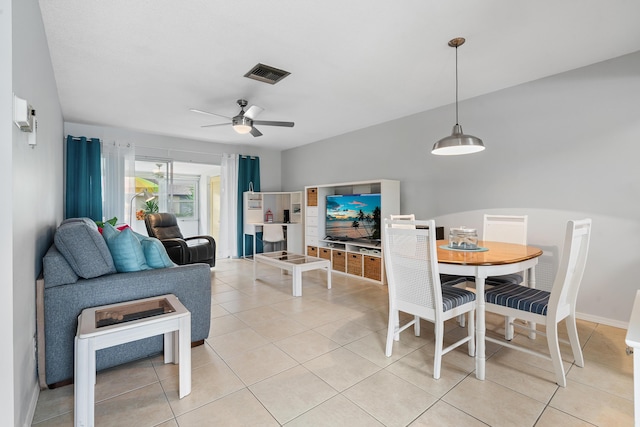 dining room with light tile patterned flooring and ceiling fan