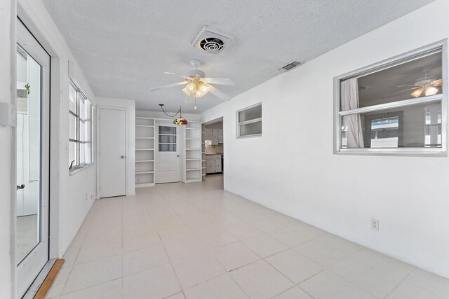 empty room featuring a textured ceiling