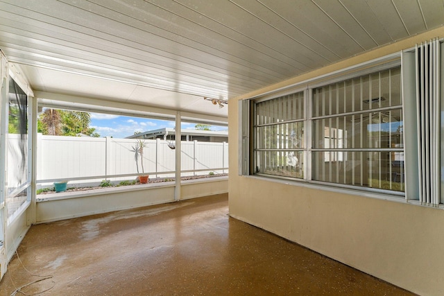 unfurnished sunroom featuring wooden ceiling