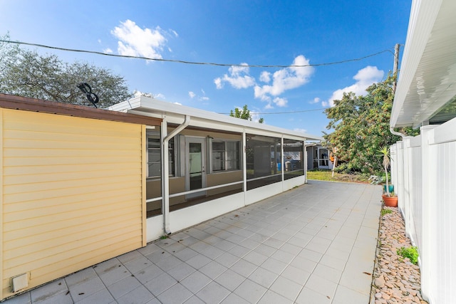 view of patio with a sunroom