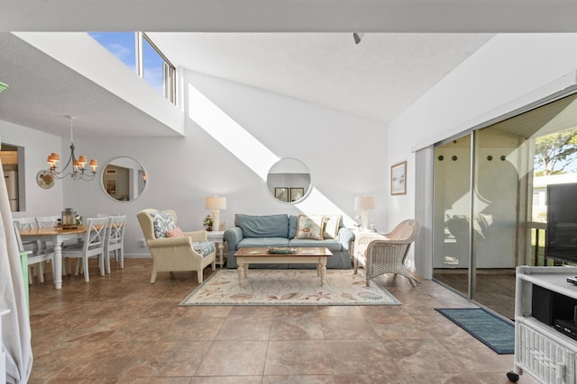 living room featuring a towering ceiling and an inviting chandelier