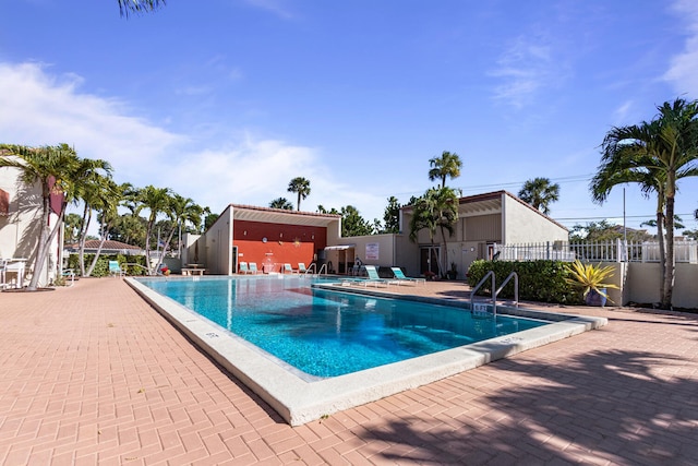 view of swimming pool featuring a patio area