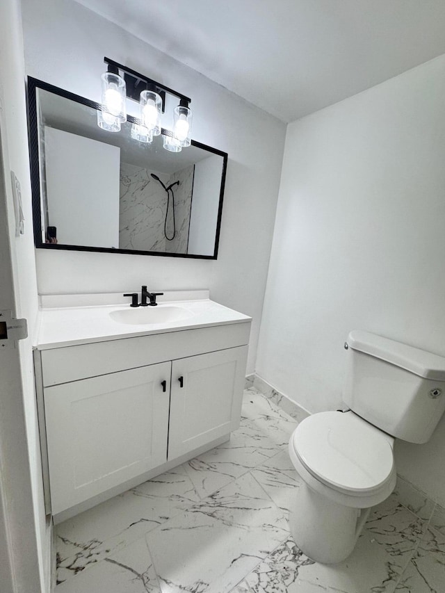 bathroom featuring vanity, toilet, and walk in shower