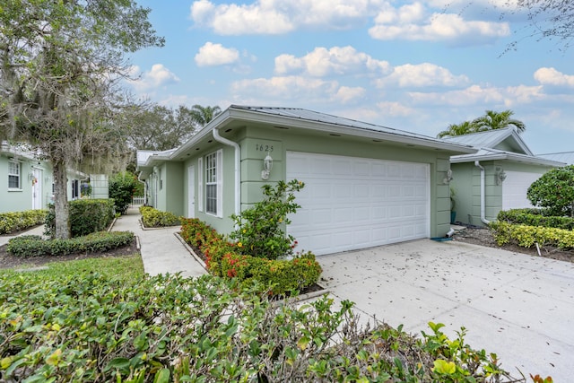 view of side of home featuring a garage