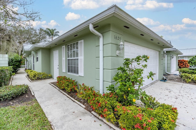 view of property exterior featuring a garage