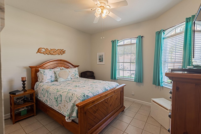 tiled bedroom with ceiling fan