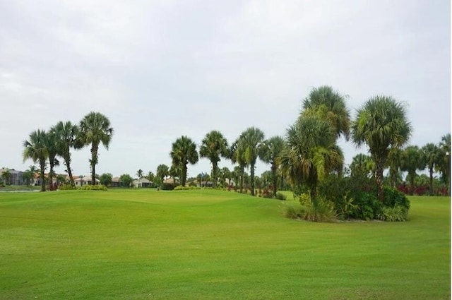 view of property's community with a lawn