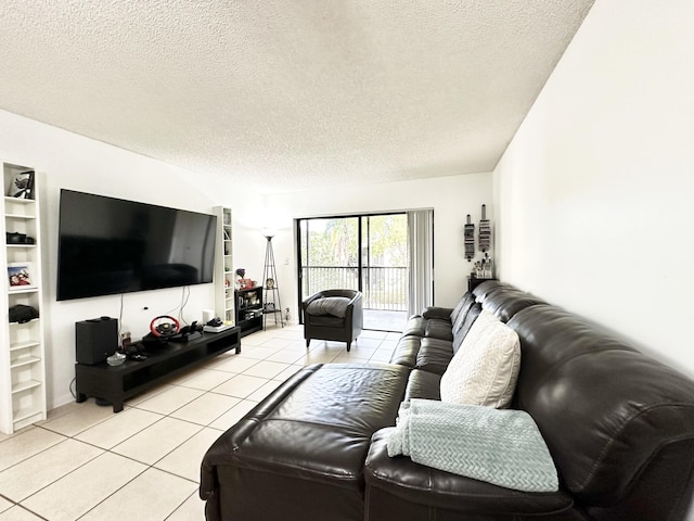 living room featuring light tile patterned floors and a textured ceiling