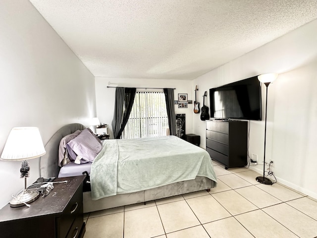 tiled bedroom with a textured ceiling