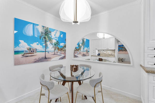 tiled dining space with crown molding