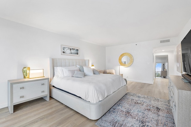 bedroom featuring light wood-type flooring