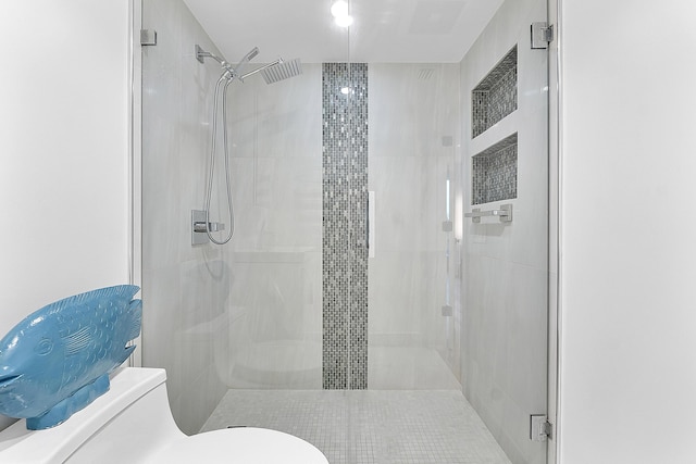 bathroom with toilet and walk in shower