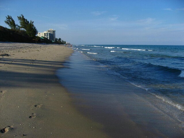 view of water feature with a beach view