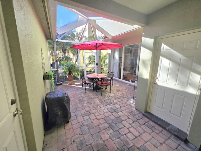 view of patio / terrace with a lanai