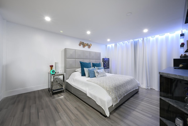 bedroom with hardwood / wood-style floors