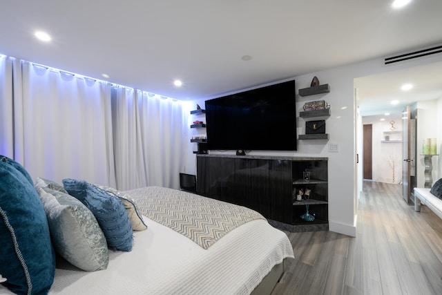 bedroom featuring hardwood / wood-style floors