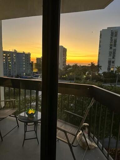 view of balcony at dusk