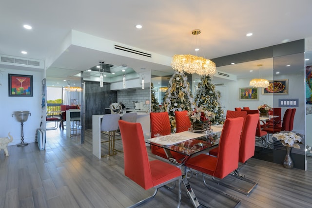 dining area with a chandelier and hardwood / wood-style flooring