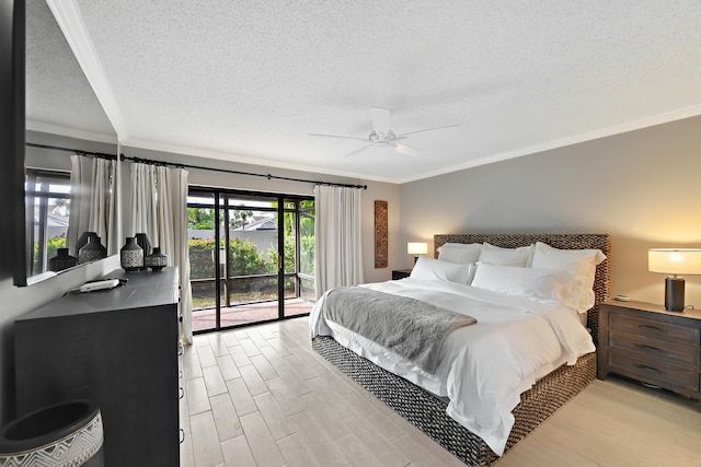 bedroom featuring ceiling fan, access to exterior, ornamental molding, and a textured ceiling