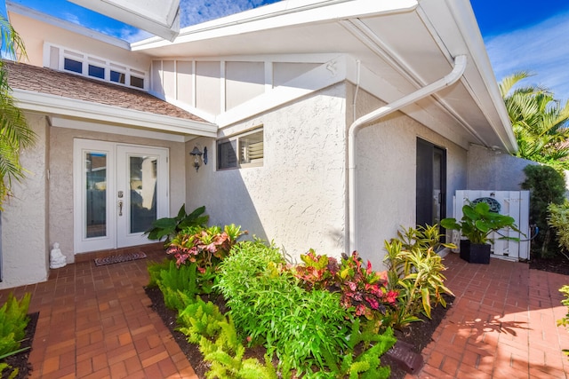 entrance to property featuring a patio and french doors