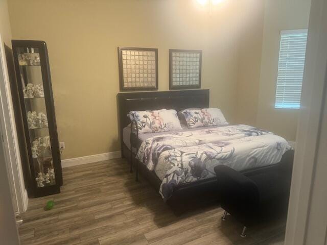 bedroom featuring hardwood / wood-style flooring