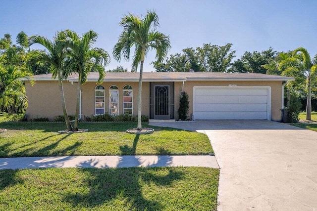 single story home with a front yard and a garage