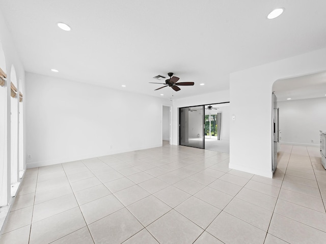 unfurnished room featuring ceiling fan and light tile patterned floors