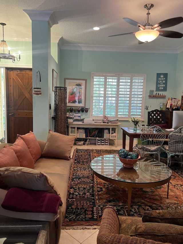 living room with light tile patterned floors, crown molding, and ceiling fan