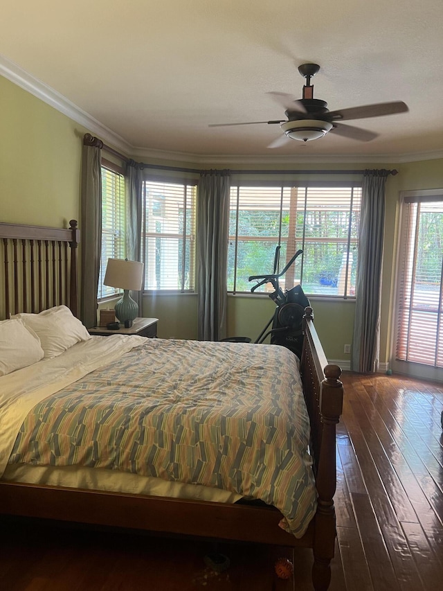 bedroom featuring crown molding, ceiling fan, and dark hardwood / wood-style flooring