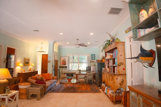 12858 153rd Ct N, Jupiter, FL 33478 - living area featuring visible vents, ornamental molding, ceiling fan with notable chandelier, and light tile patterned flooring