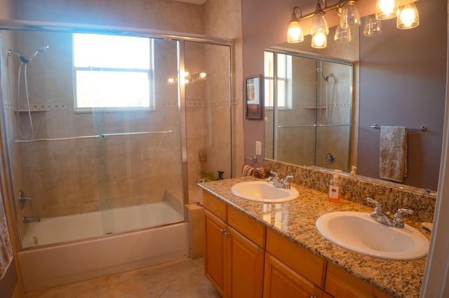 12858 153rd Ct N, Jupiter, FL 33478 - full bath with double vanity, enclosed tub / shower combo, tile patterned flooring, and a sink