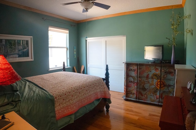 12858 153rd Ct N, Jupiter, FL 33478 - bedroom with ornamental molding, ceiling fan, and wood finished floors
