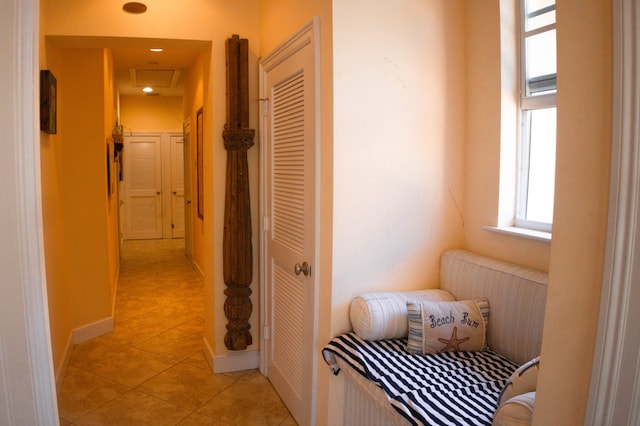 12858 153rd Ct N, Jupiter, FL 33478 - hallway featuring baseboards and light tile patterned flooring