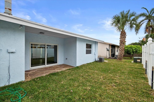 view of yard featuring central AC and a patio area