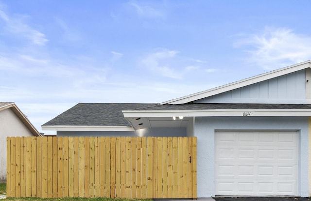 view of side of property with a garage