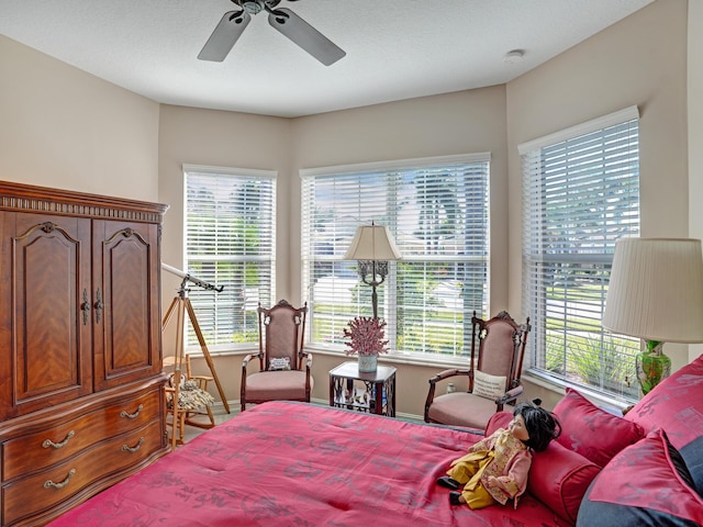 bedroom with multiple windows and ceiling fan