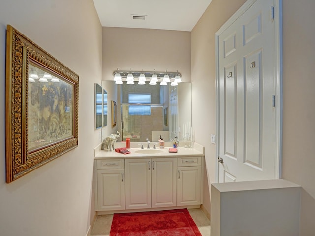 bathroom featuring tile patterned floors and vanity