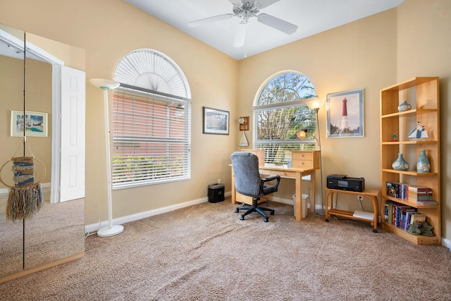 carpeted office featuring ceiling fan