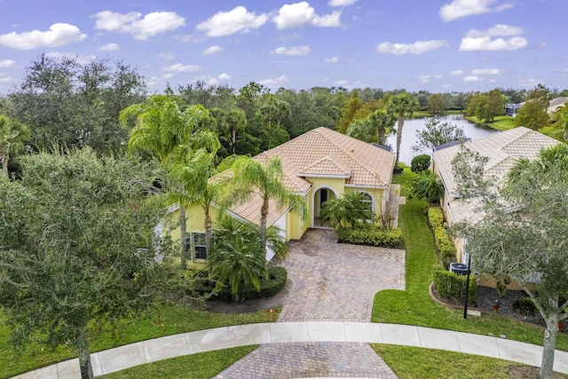 birds eye view of property with a water view