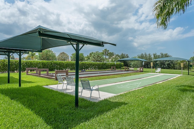 view of home's community with a lawn