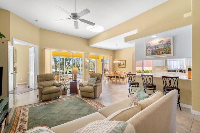 tiled living room with ceiling fan