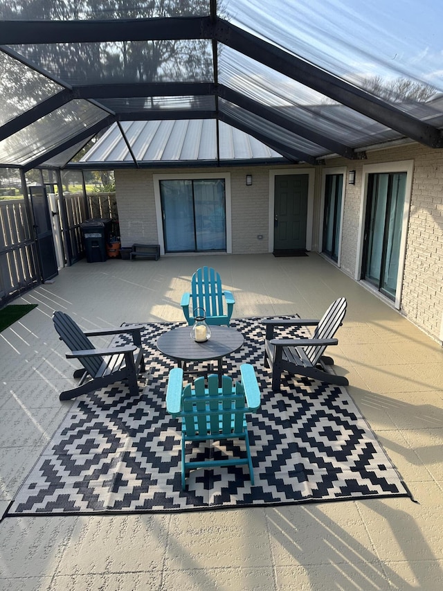 view of patio / terrace with a lanai