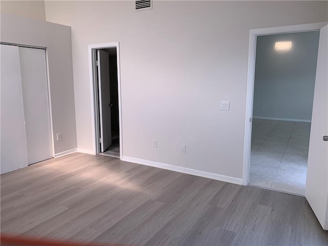 unfurnished bedroom featuring light wood-type flooring