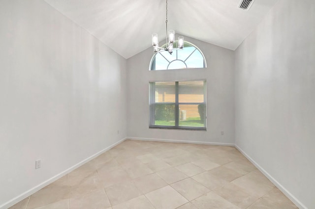 empty room featuring light tile patterned floors, baseboards, visible vents, vaulted ceiling, and a chandelier