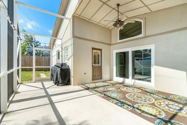 exterior space featuring ceiling fan