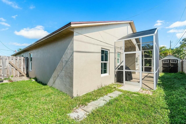 rear view of house with a yard