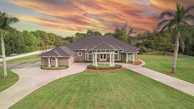 view of front of house with a lawn